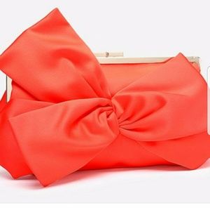 bebe Orange satin clutch